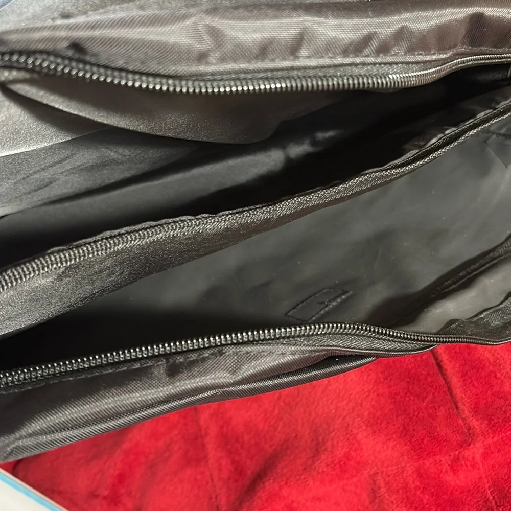 Messenger bag features laptop sleeve- multi- function pockets— Adjustable strap